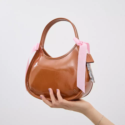 Coach Ergo Bag In Crinkle Patent Topia Leather With Bows In Burnished Amber/light Pink