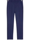 Versace Pressed-crease Tapered-leg Trousers In Blue