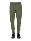 Alexander Mcqueen Jogging Pants With Graffiti Logo In Brown