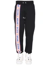Gcds Jogging Pants With Cute Tape Logo Band In Black