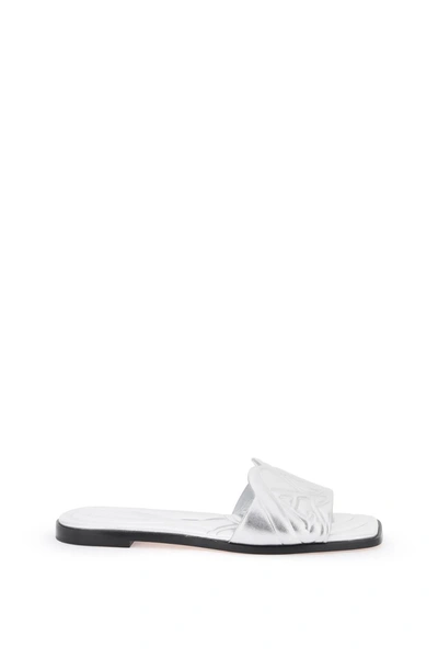 Alexander Mcqueen Slides In Pelle Laminata Con Logo Seal Impresso In Silver