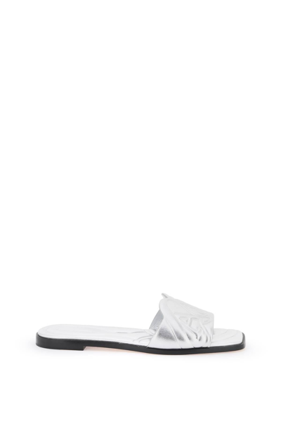 ALEXANDER MCQUEEN ALEXANDER MCQUEEN LAMINATED LEATHER SLIDES WITH EMBOSSED SEAL LOGO
