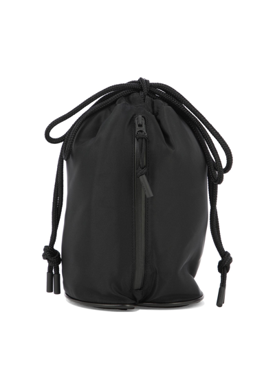 Sacai Monogram-embroidered Drawstring Bucket Bag In Black