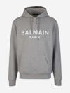 Balmain Logo Printed Drawstring Hoodie In Gris Clar