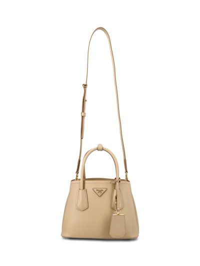 Prada Logo Detailed Top Handle Tote Bag In Sabbia