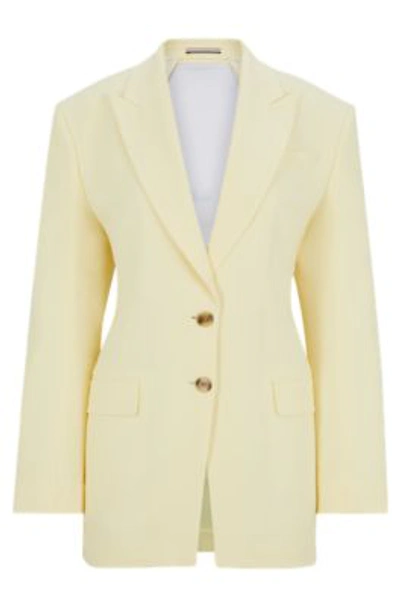 Hugo Boss Oversize-fit Jacket With Adjustable Open Back In Light Yellow