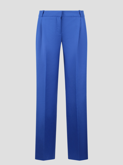 Coperni Low Rise Loose Tailored Trousers In Blue