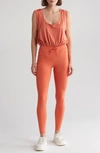 FP MOVEMENT FP MOVEMENT BY FREE PEOPLE OFF TO THE RACES SLEEVELESS JUMPSUIT