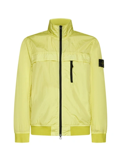 Stone Island Coats In Yellow