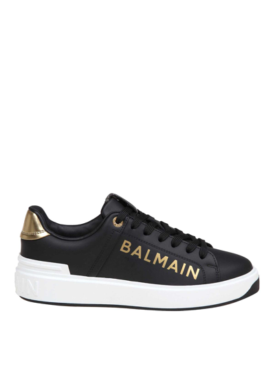 Balmain B-court Sneakers In Black And Gold Leather In Black/gold
