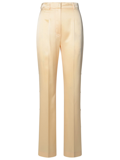 Nanushka Felina Alt-leather Button Side Pants In Cream