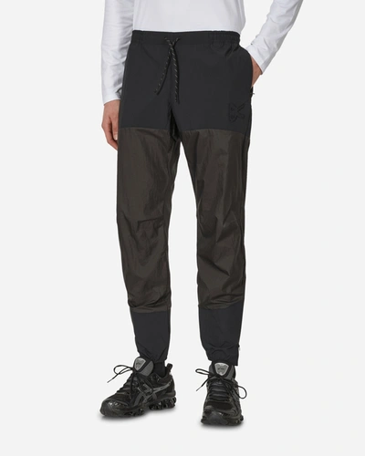 District Vision Ultralight Dwr Paneled Track Pants In Black