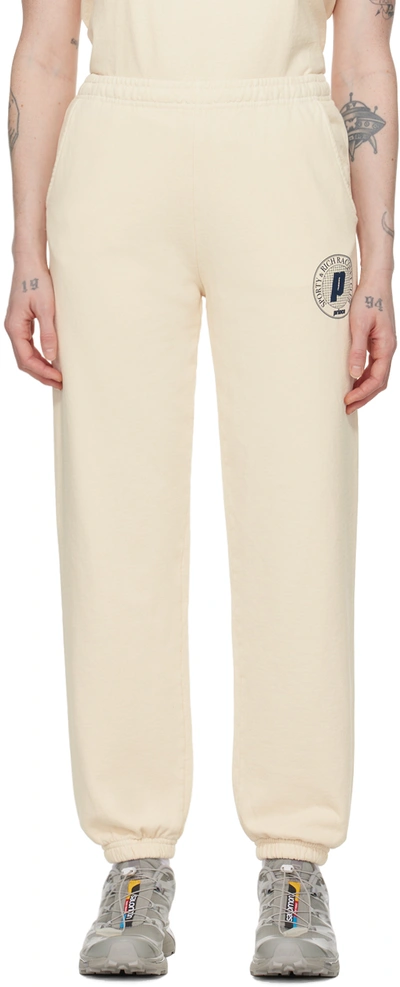 Sporty And Rich + Prince Net Printed Cotton-jersey Track Trousers In Beige