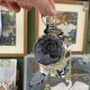 FERNE CREATIVE AMMONITE FOSSIL KEYCHAIN, ECO FRIENDLY GIFT, NATURAL HISTORY