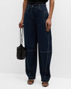 SIMKHAI KAIRI CURVED-LEG TOPSTITCHED DENIM PANTS