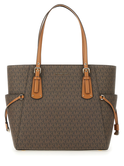 Michael Michael Kors Signature Voyager East West Tote In Brown