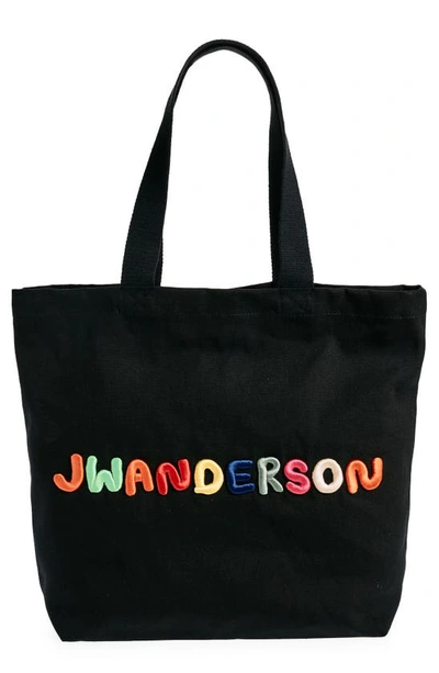 Jw Anderson Logo Embroidered Canvas Tote In Black