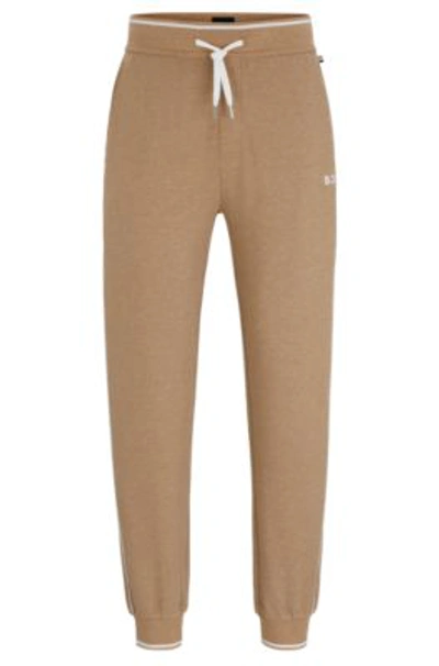 Hugo Boss Piped Tracksuit Bottoms With Embroidered Logo And Drawstring Waist In Beige