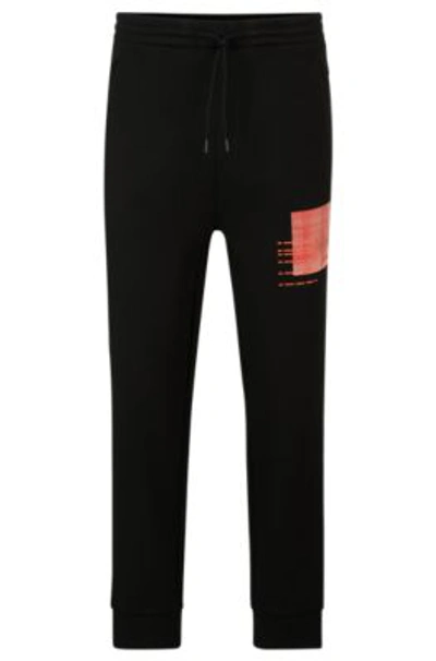 Hugo Boss Tracksuit Bottoms With Seasonal Artwork In Black