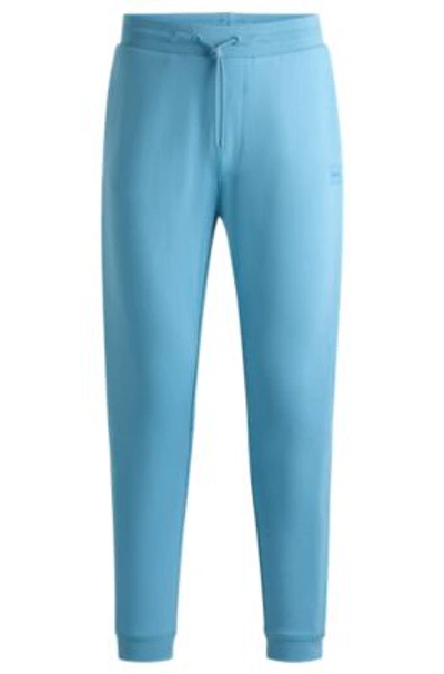 Hugo Boss Cotton-terry Tracksuit Bottoms With Logo Patch In Light Blue