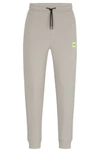 Hugo Cotton-terry Tracksuit Bottoms With Red Logo Label In Light Grey