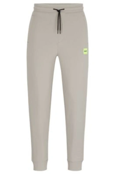 Hugo Cotton-terry Tracksuit Bottoms With Red Logo Label In Light Grey
