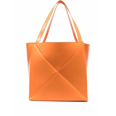 Nanushka Logo Embossed Folded Tote Bag In Orange