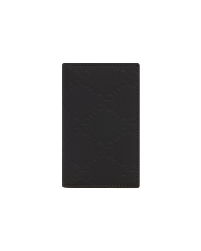 Gucci Gg Embossed Long Card Holder In Black