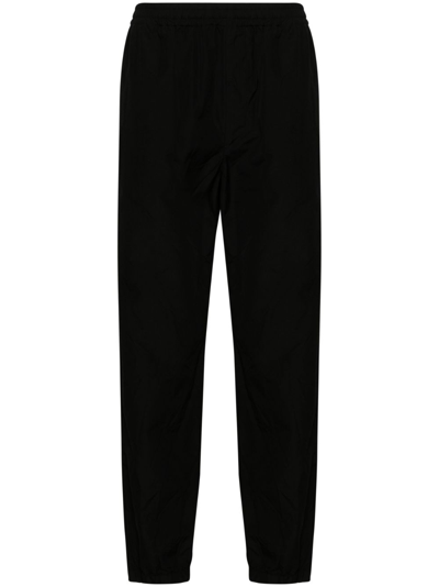 Auralee Tapered-leg Wool Trousers In Black