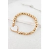 ENVY GOLD BEAD STRETCH BRACELET WITH WHITE HEART