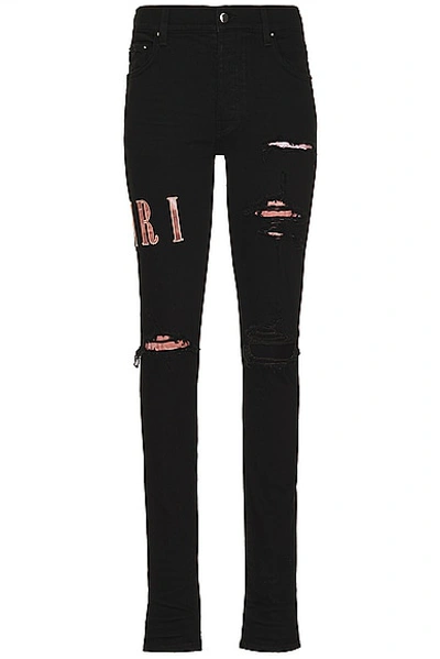 Amiri Skinny-jeans Mit Logo-applikation In Black