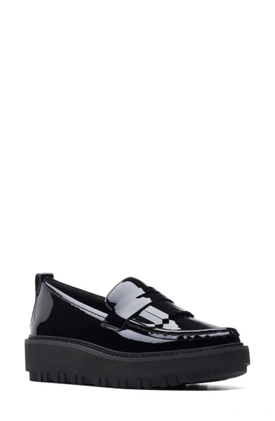 Clarks Orianna Kiltie Wedge Penny Loafer In Black Pat Lea