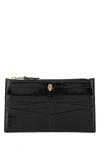 Alexander Mcqueen Skull Embossed Zipped Wallet In Black