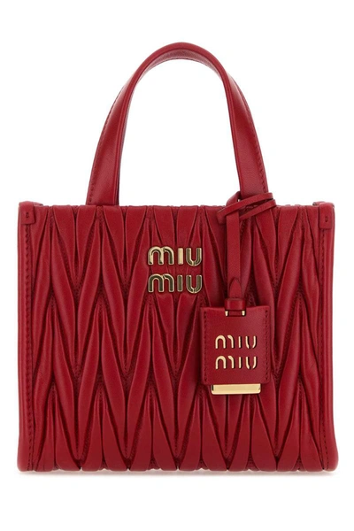 Miu Miu Handbags. In Red