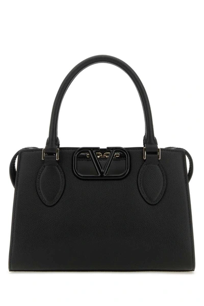 Valentino Garavani Handbags. In Black