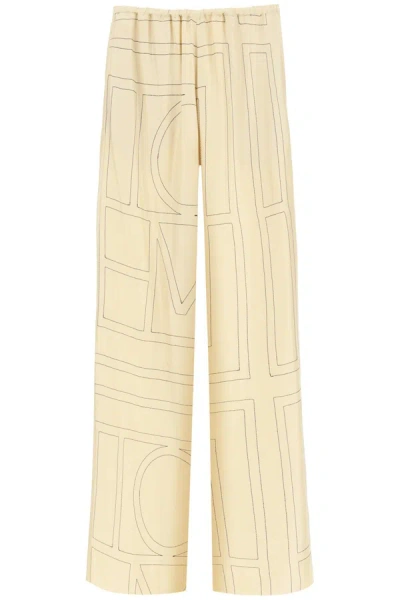 Totême Monogram Embroidered Pajama Trousers In Beige