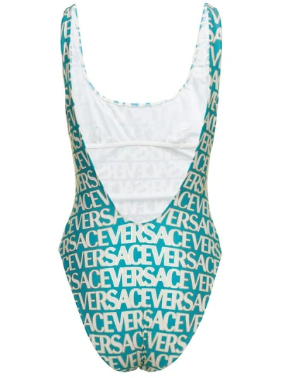 VERSACE BLUE ONE-PIECE SWIMSUIT WITH ALL-OVER LOGO LETTERING PRINT IN STRETCH TECH FABRIC WOMAN