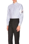 THOM BROWNE THOM BROWNE OXFORD BUTTON DOWN WITH EMBROIDERY PATCH ARM BAND IN BLUE,MWL220E 02581
