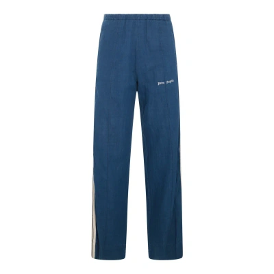 Palm Angels Track Pants With Side Stripe Detail In Indigo Blue