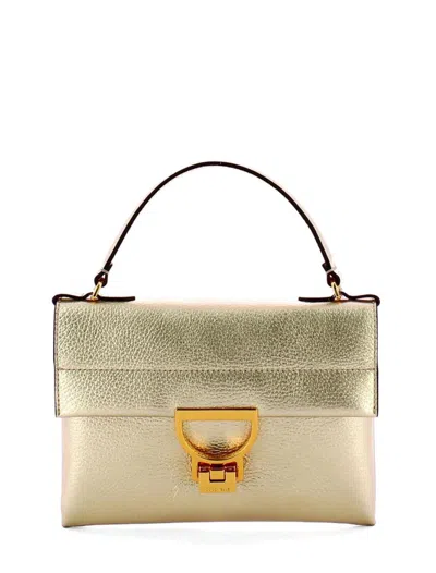 Coccinelle Bags.. Golden