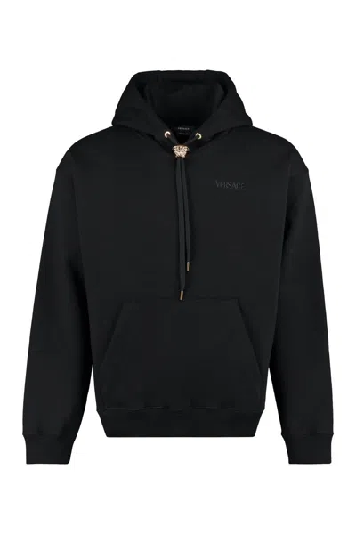 Versace Logo Embroidered Drawstring Hoodie In Black