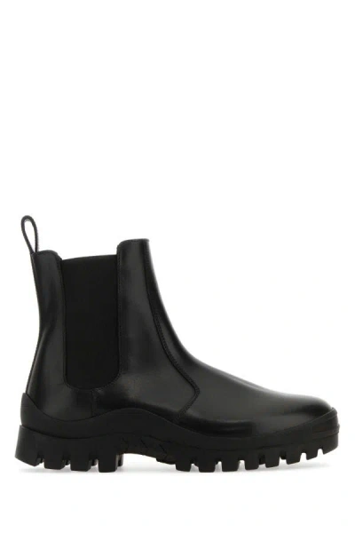 The Row Greta Leather Lug-sole Chelsea Boots In Black