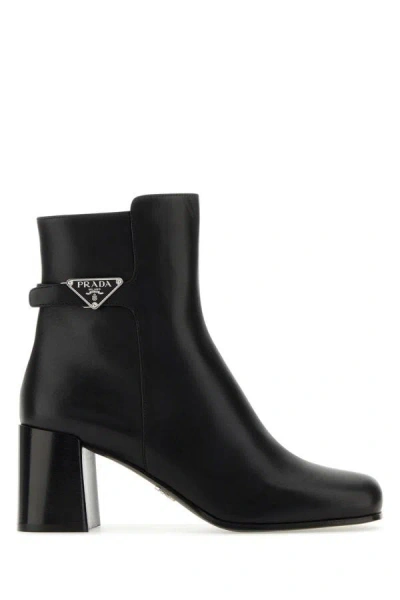 Prada Triangle-plaque Ankle Boots In Black