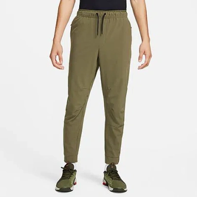 Nike Men's Unlimited Dri-fit Zippered Cuff Versatile Pants In Medium Olive/black