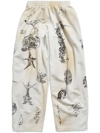 Balenciaga Wide-leg Printed Distressed Cotton-jersey Sweatpants In White