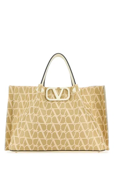 Valentino Garavani Handbags. In Gold