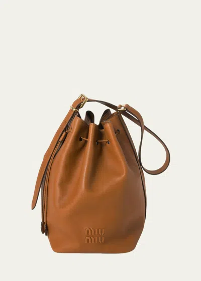 Miu Miu Drawstring Leather Bucket Bag In F0046 Cognac