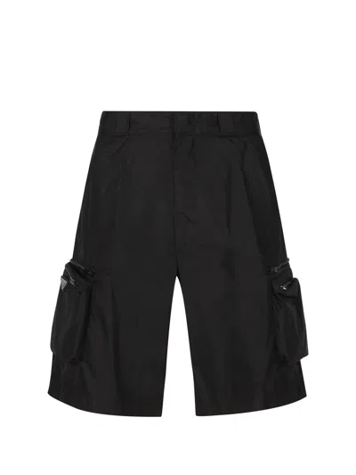 Prada Logo Plaque Zipped Shorts In Nero