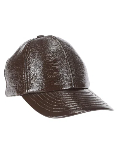 Courrèges Logo Patch Curved Peak Baseball Cap In Brown