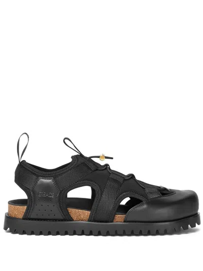 Versace Logo-debossed Caged Sandals In Black